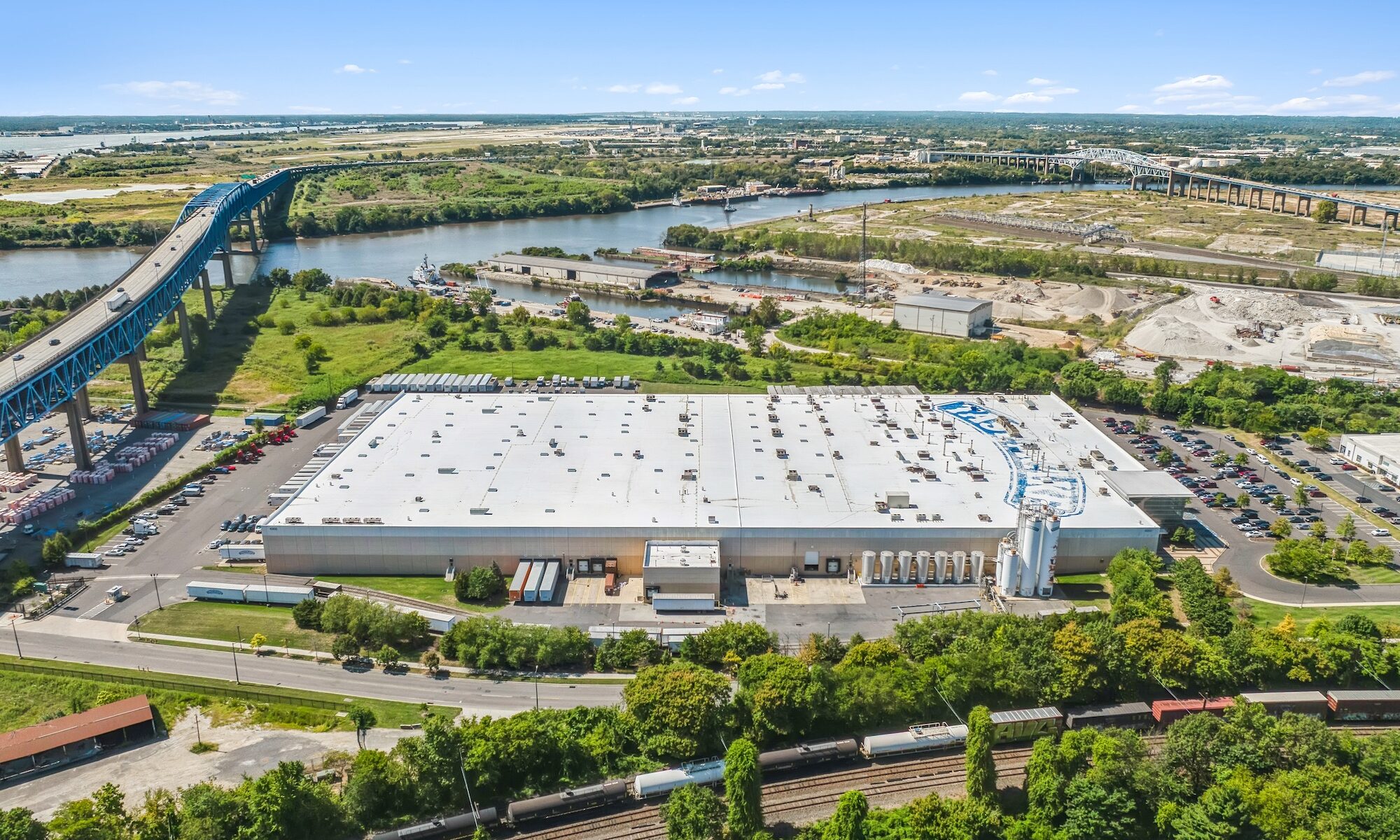 Industrial commercial real estate photography showing site scale, yard area, loading zones, and truck access