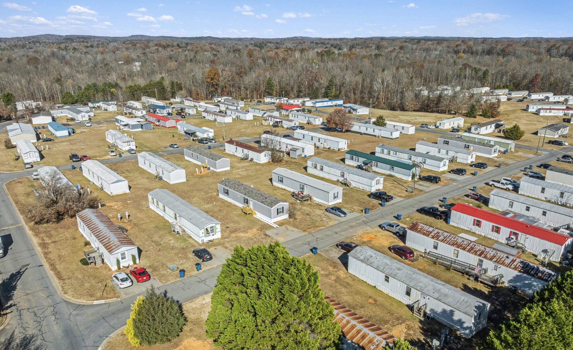 Mobile home community commercial real estate photography showing organization, internal roads, amenities, and access