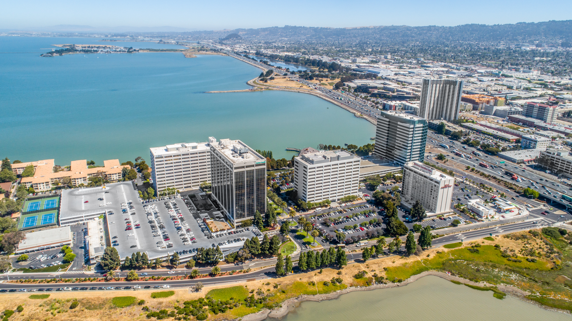 Office building commercial real estate photography showing curb appeal, building frontage, parking, and nearby amenities