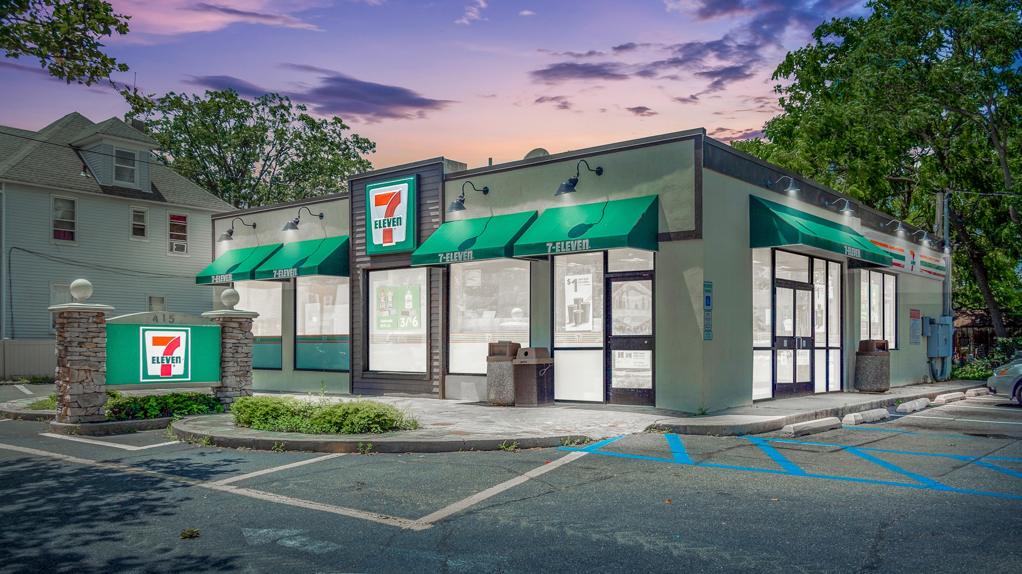Virtual twilight of a 7-Eleven convenience store with monument signage, entrance, and parking lot