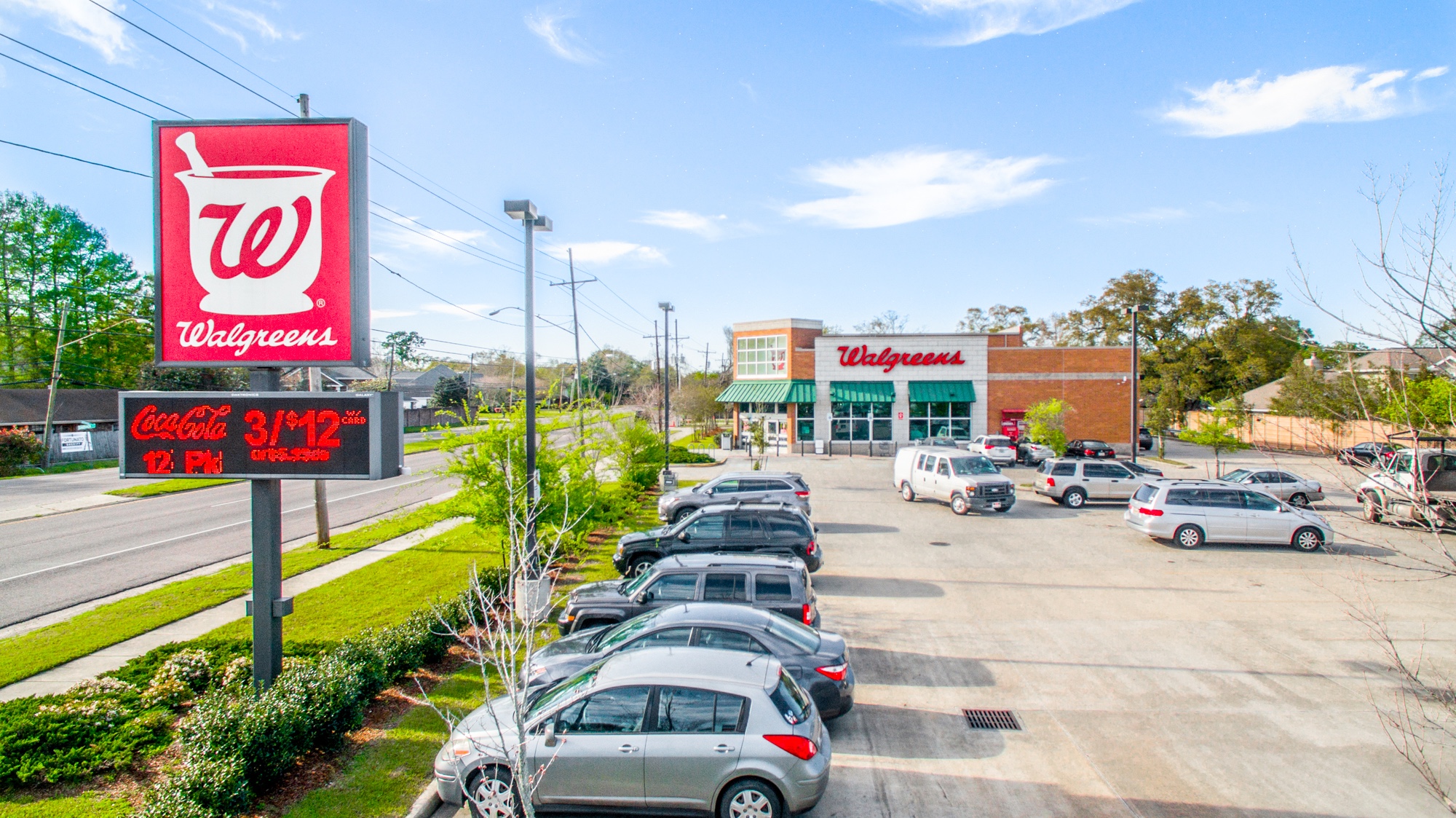 Aerial photograph of a Walgreens pharmacy with monument signage, drive-through, and parking lot