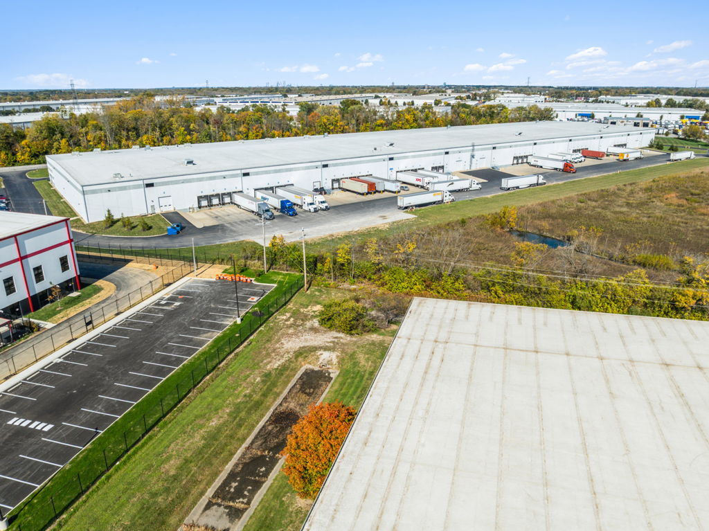 Aerial drone photography of distribution center showing loading docks and truck court