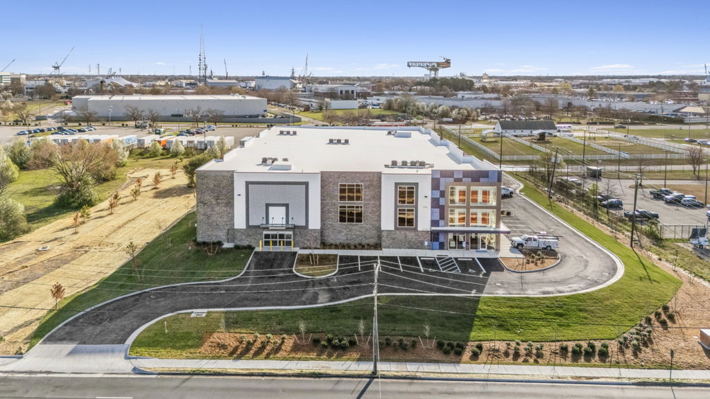 Aerial drone photography of modern flex office and warehouse facility with new construction