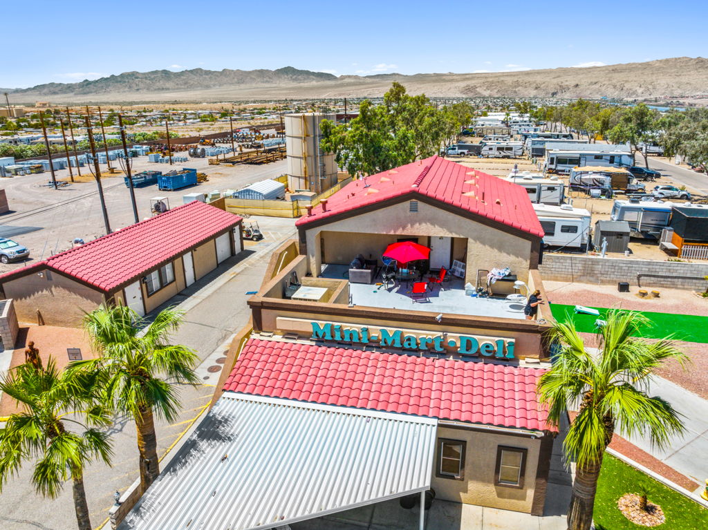 Aerial drone photography of mobile home community clubhouse and mini mart with desert RV park