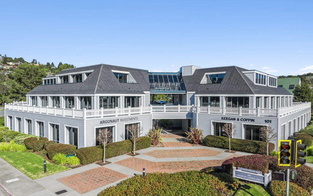 Aerial photography of suburban multi-tenant office building with landscaped brick entrance walkway