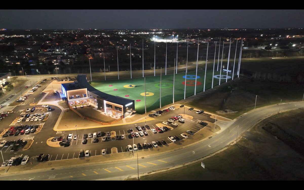 Custom nighttime aerial photography of an entertainment venue with dramatic lighting