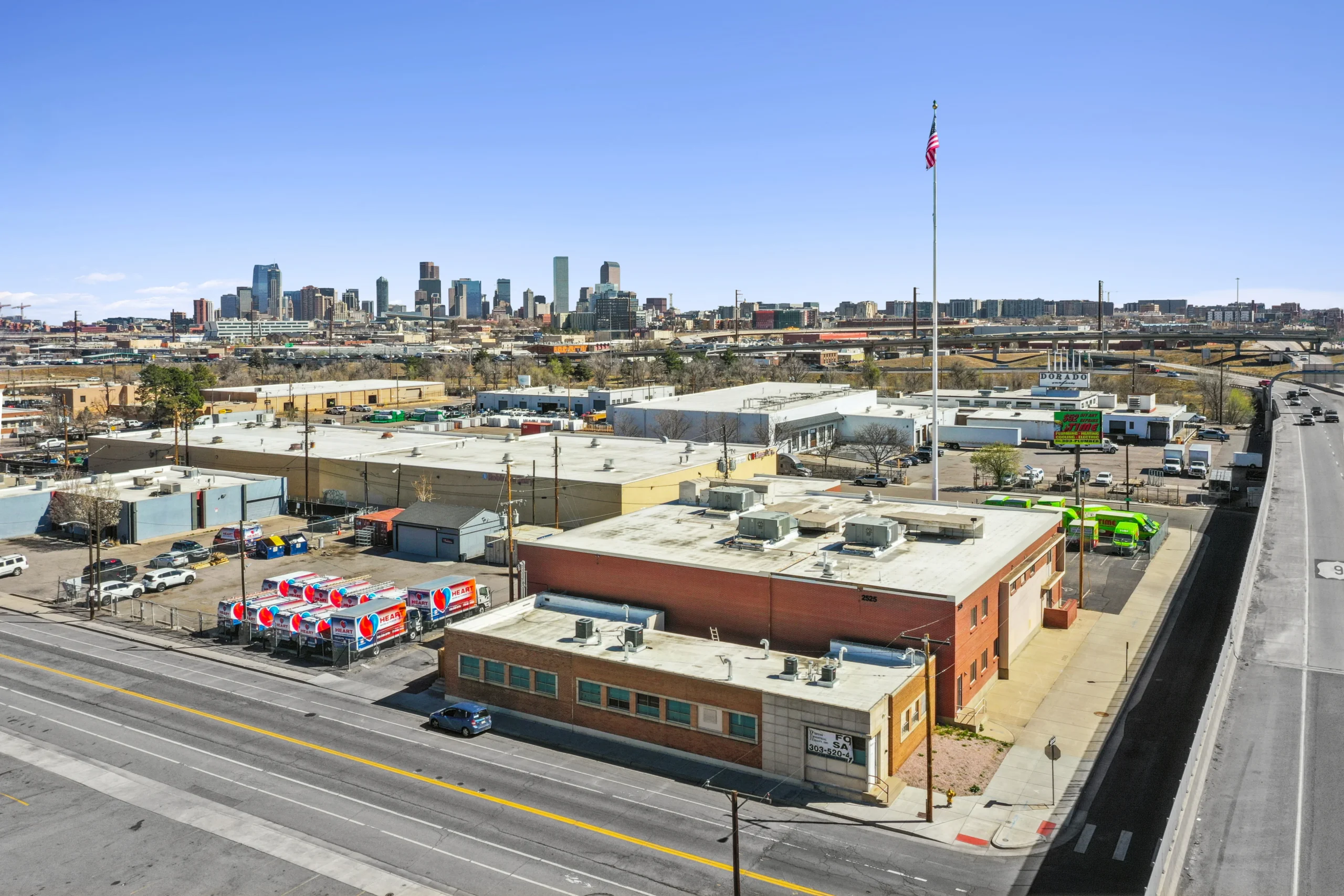 Aerial drone photography of cold storage industrial facility with refrigerated truck court
