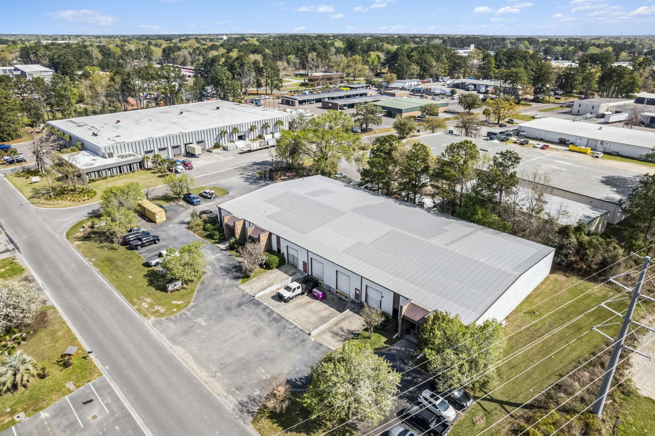 Aerial drone photography of multi-tenant flex industrial buildings with roll-up doors
