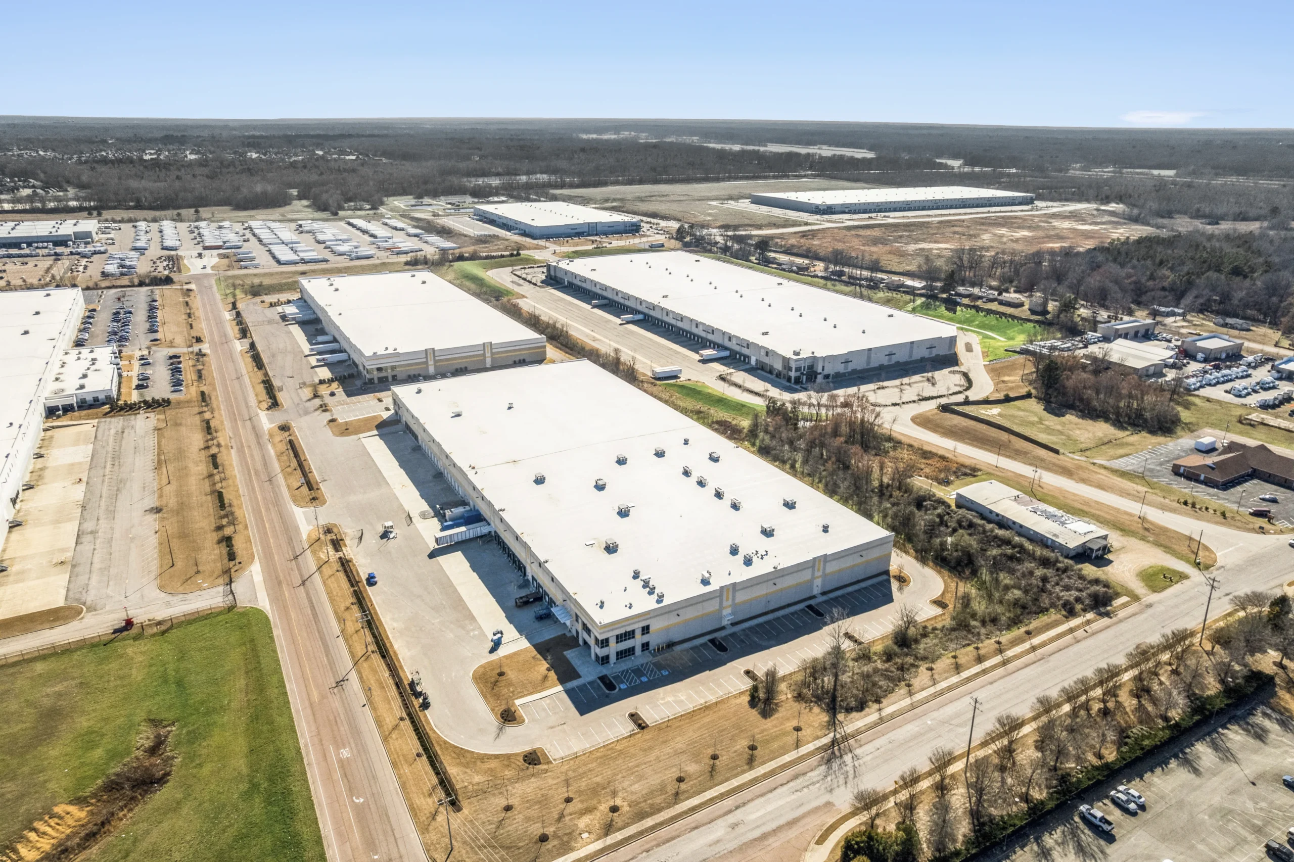 Aerial drone photography of multi-building industrial logistics park with loading docks