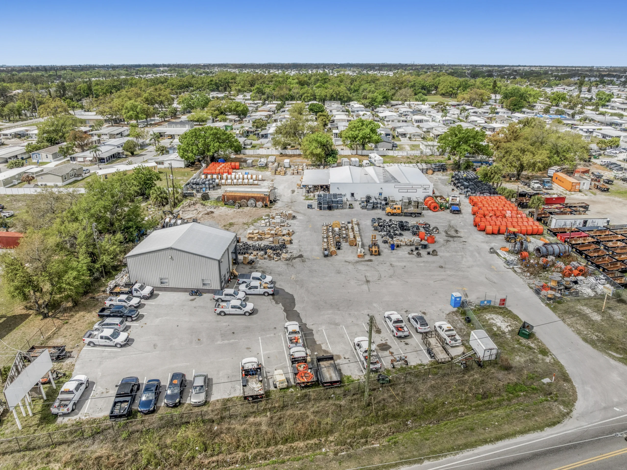 Aerial drone photography of multi-building industrial campus with shared parking