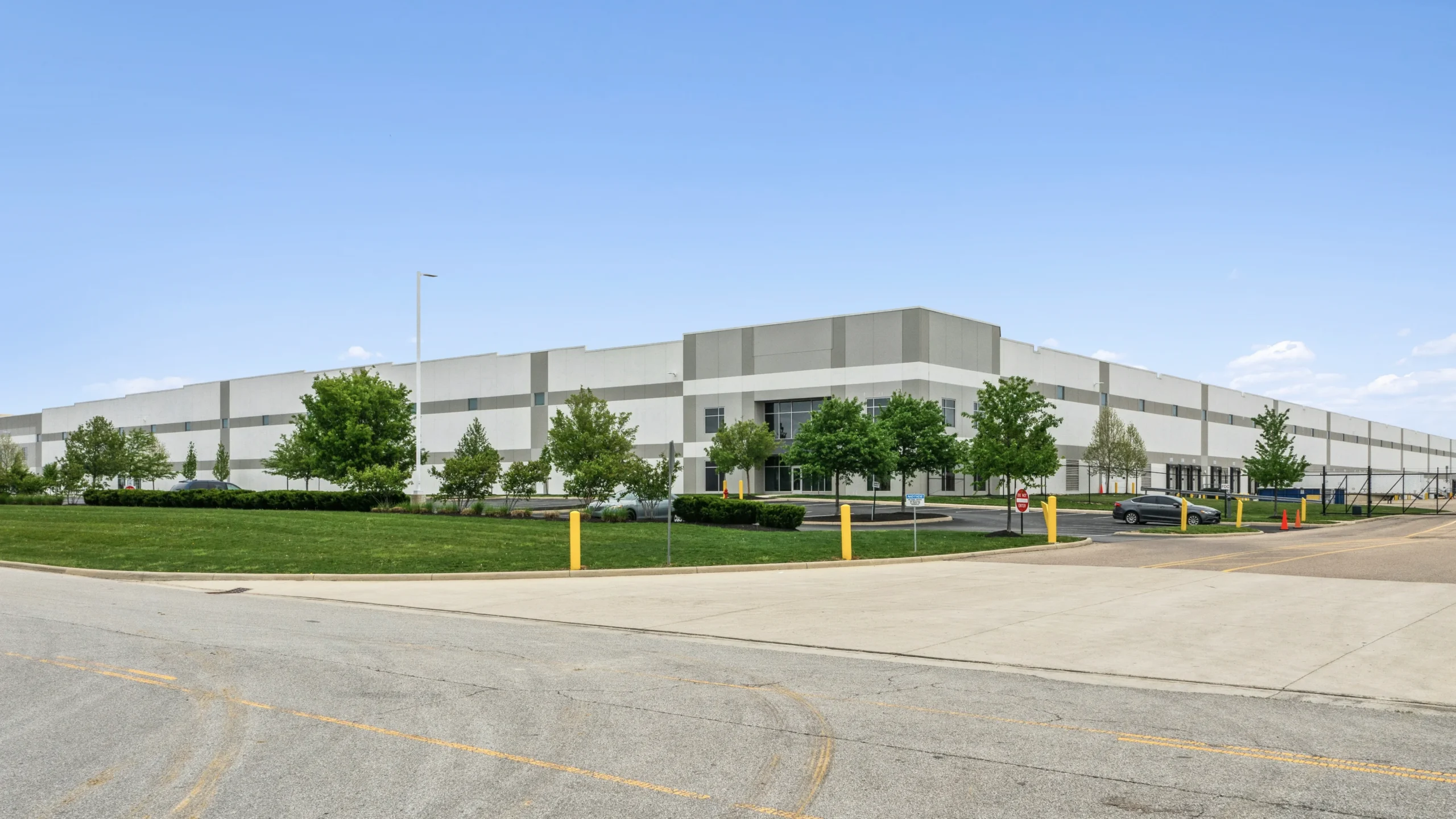 Aerial drone photography of industrial self-storage facility with surrounding commercial