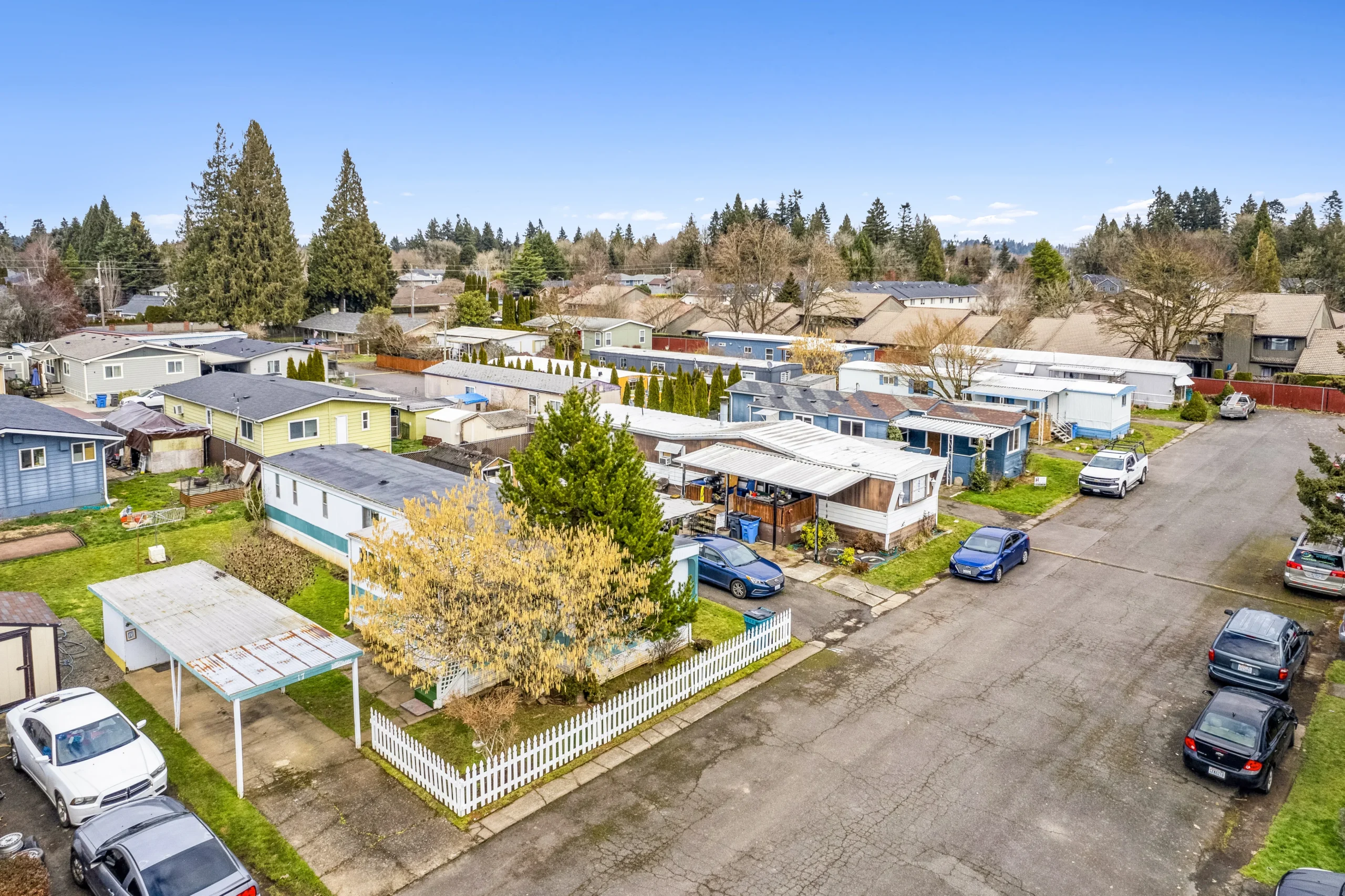 Aerial drone photography of Pacific Northwest mobile home community with residential neighborhood