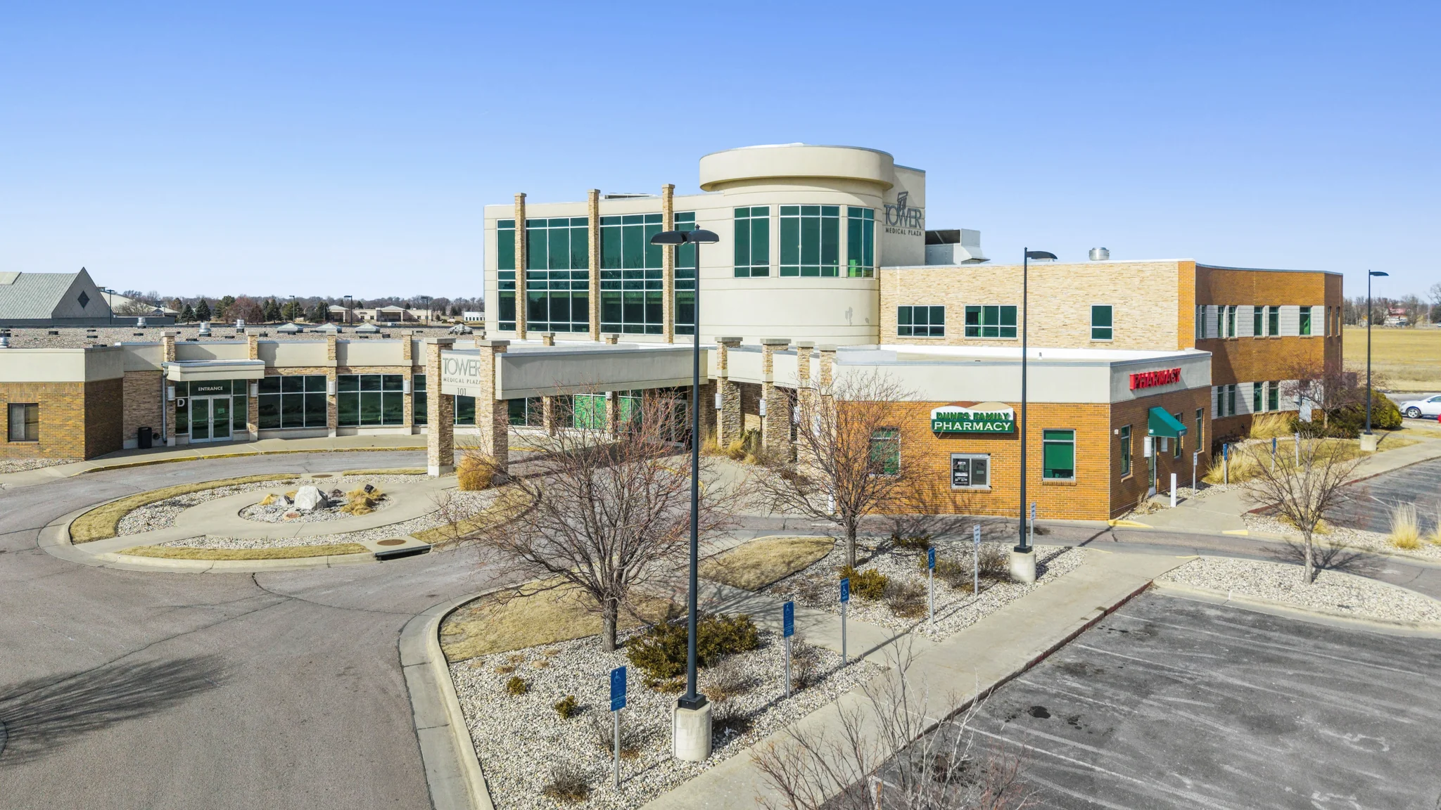 Medical office building with prominent healthcare signage and on-site pharmacy entrance