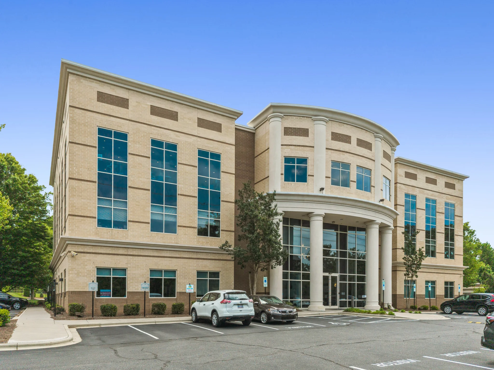Class A single-tenant office building exterior with classical columns and stone facade