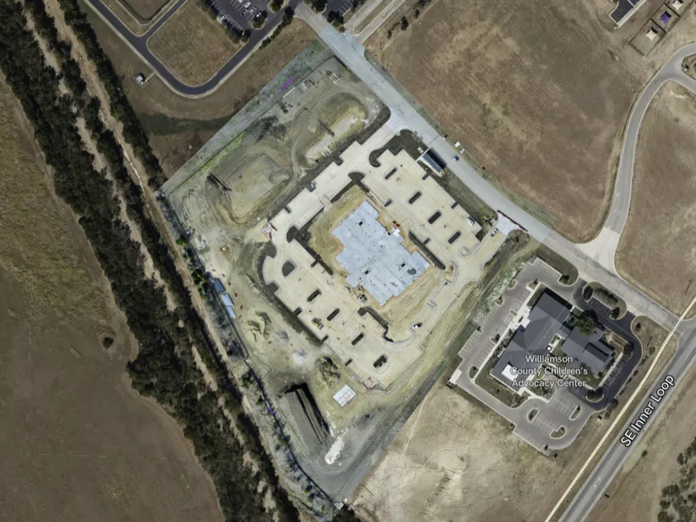 Construction site drone progress capture showing continued site development