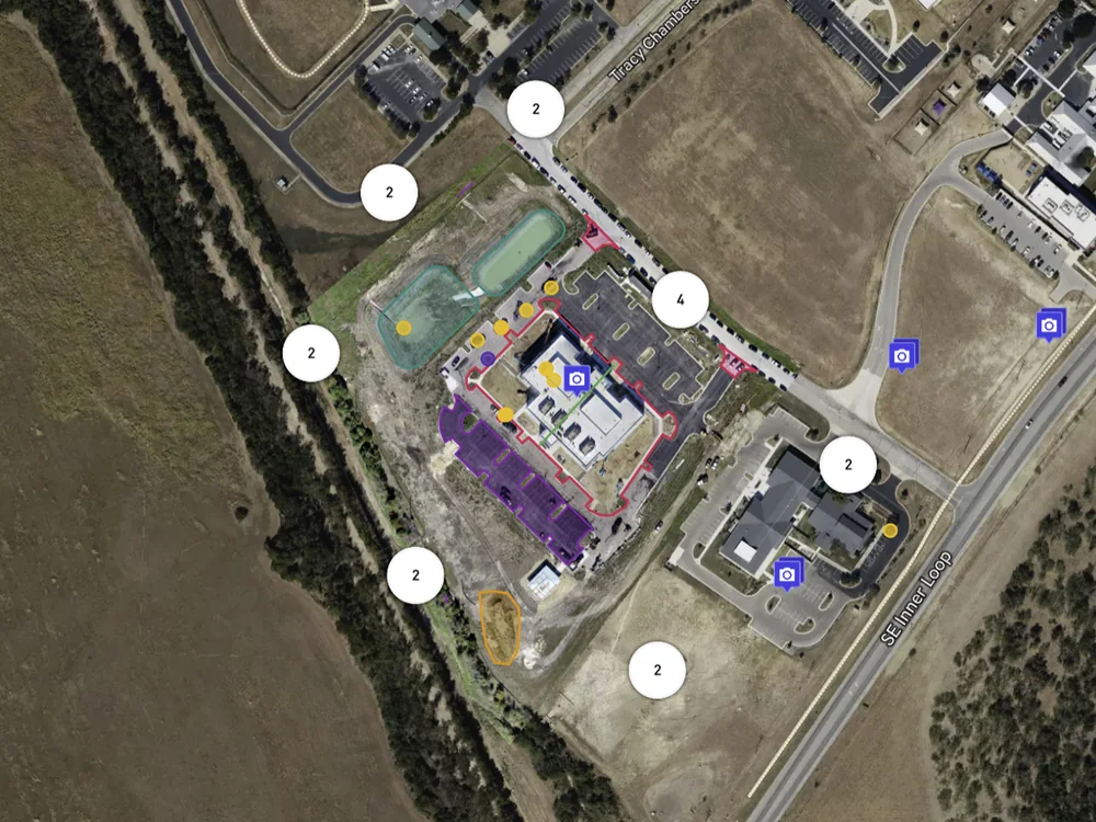 Construction site drone progress capture showing later stage project development