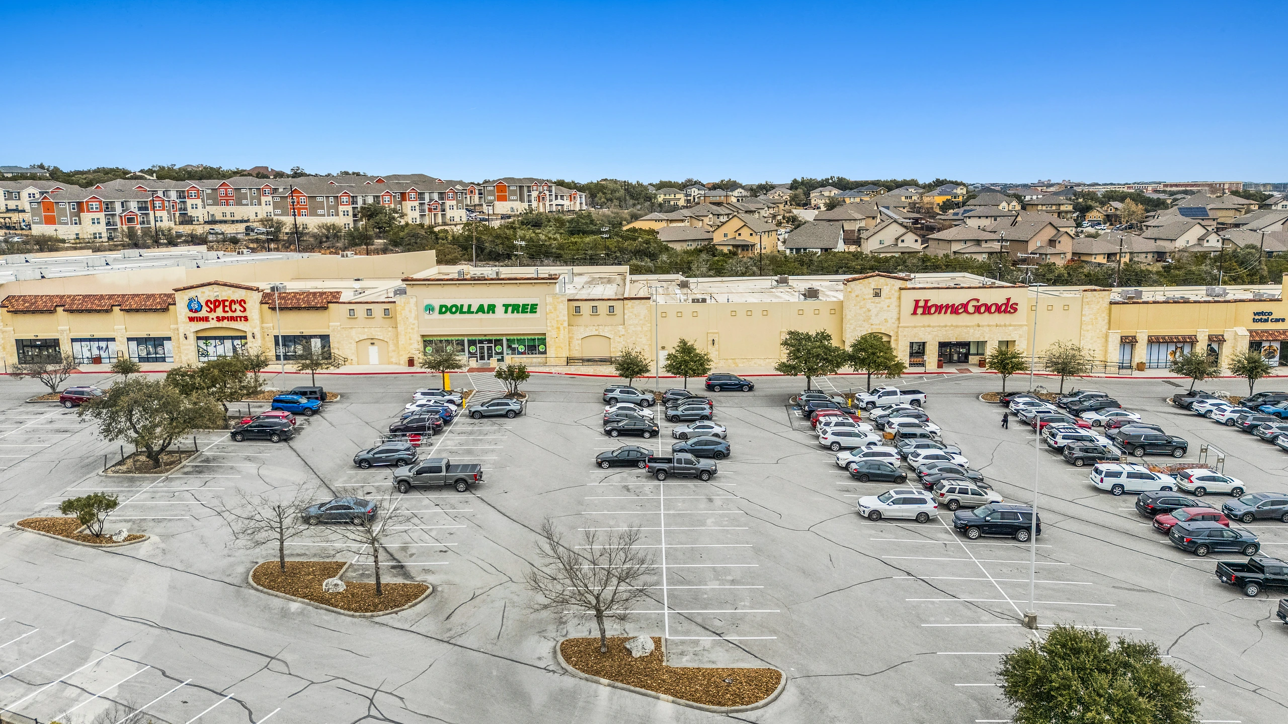 Aerial photograph of a discount-anchored retail center with dollar store and off-price inline tenants